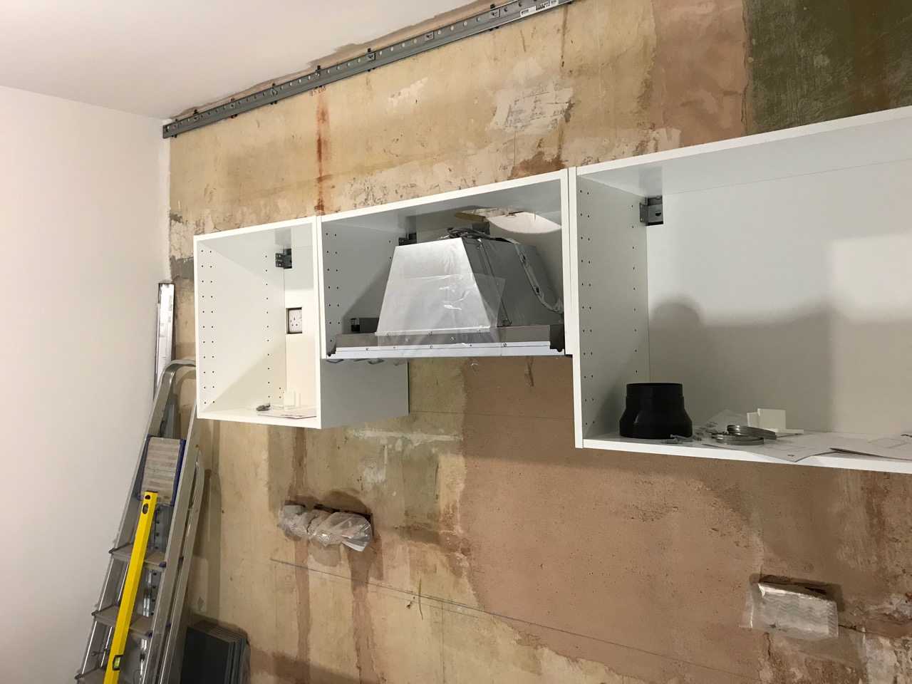 Three fitted cabinets with extractor fan