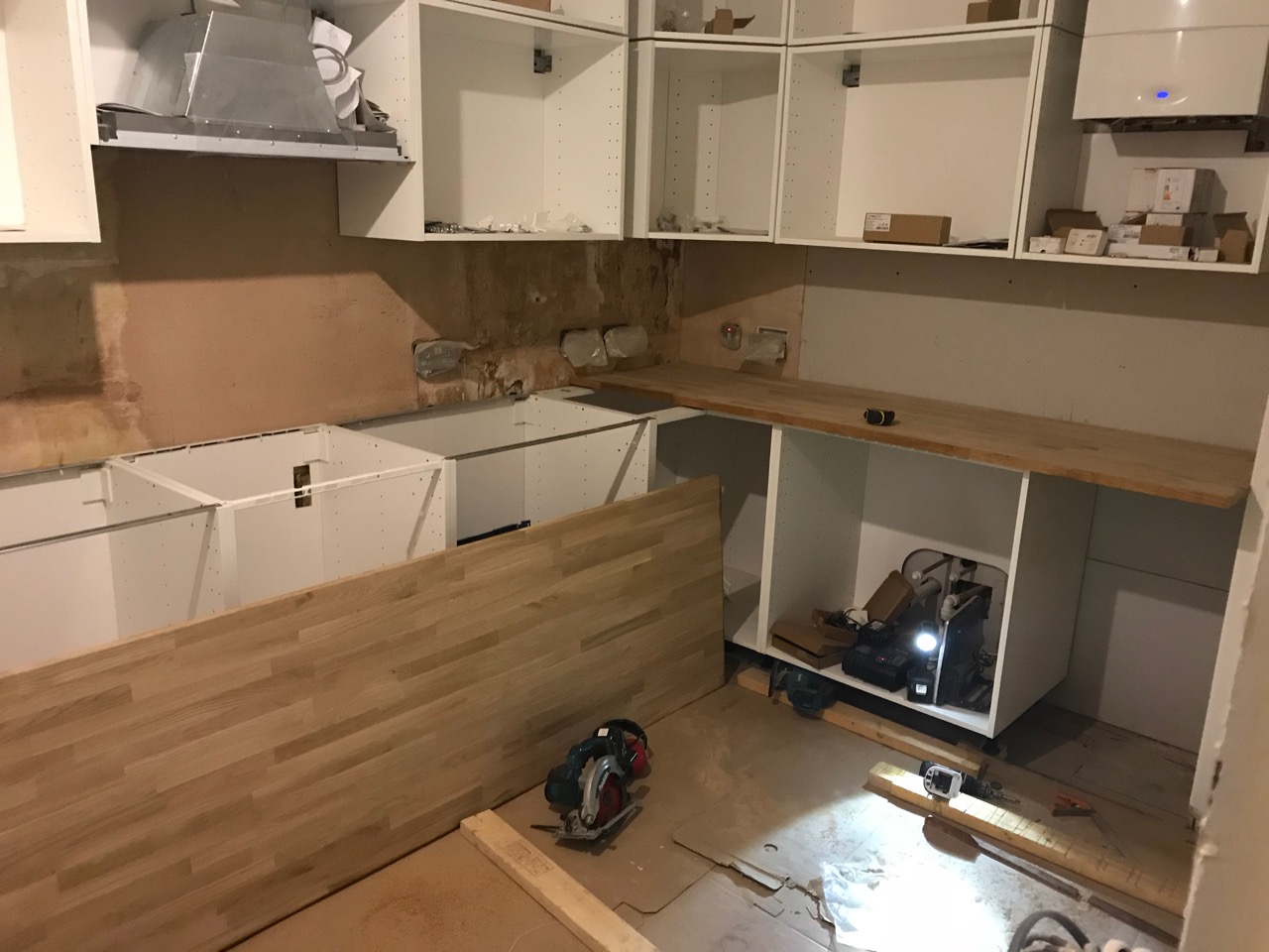 Oak worktop being fitted, one piece on the floor